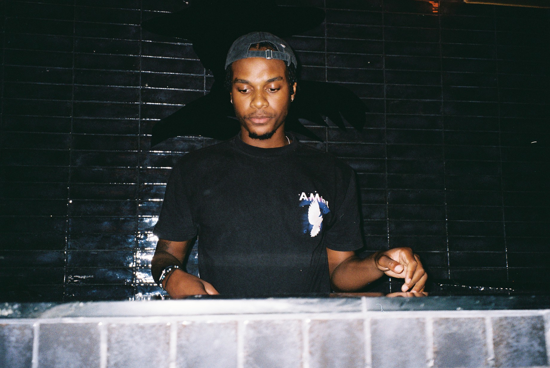 DJ Challenge performing to a packed Cape Town dance floor.