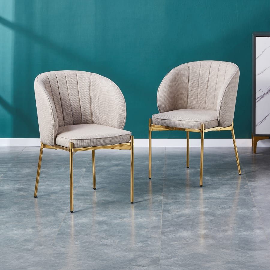 Lot de 2 chaises en tissu beige pieds en métal doré