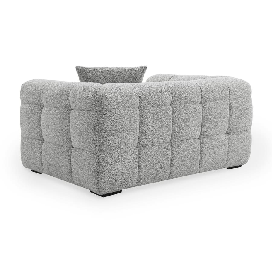 Fauteuil effet peau de mouton gris