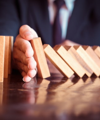 Hand stopping domino effect
