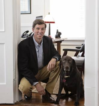 Hank Crane and his dog at the office