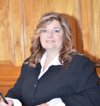 Patti B. Garner filling out contracts