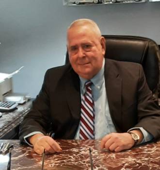 Lawrence Gordon at his desk