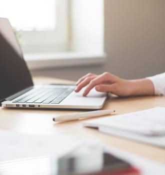 Woman typing at her computer