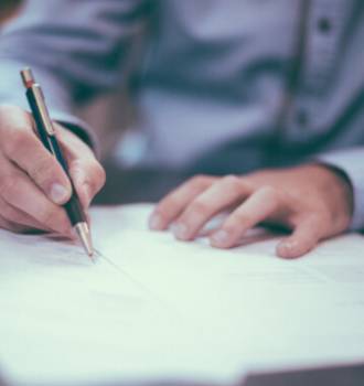 Attorney writing on paper