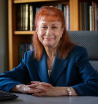 Attorney Leslee Newman sitting at desk