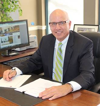 Doug Aholt working at his desk