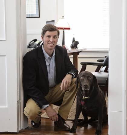 Hank Crane and his dog at the office