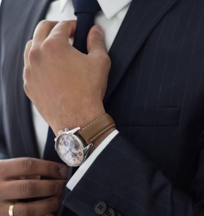 Businessman adjusting his tie