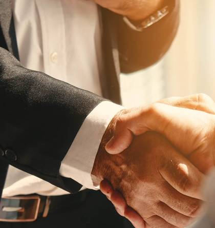 Man in suit shaking hands