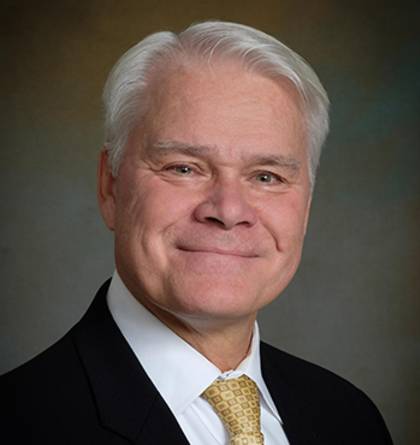 John R. Bailey smiling