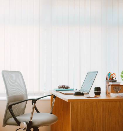 Office desk with computer and chair