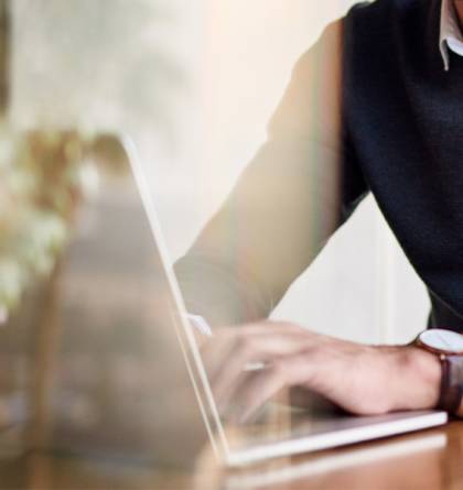 Young businessman using a laptop while working from home