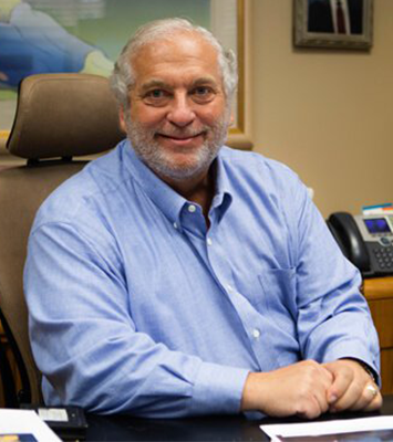 james in office sitting down