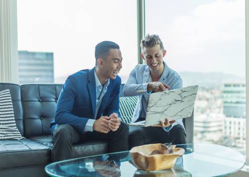 Men looking at a computer
