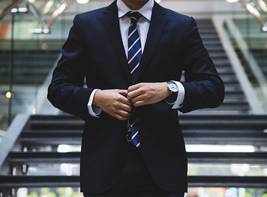 Business man unbuttoning his jacket