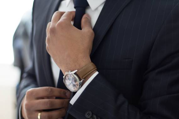Businessman adjusting his tie