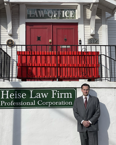Christopher “Chris” Heise in front of his law office
