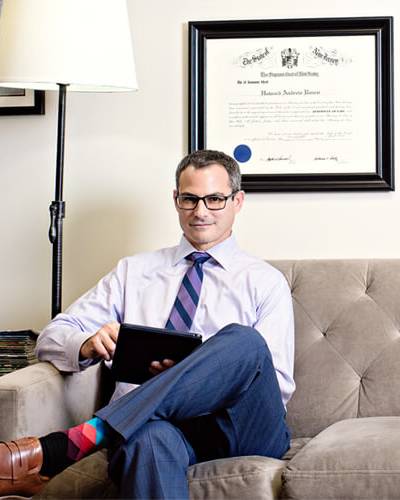 Howie sitting on a couch