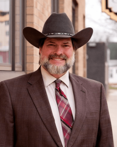 Ted Skemp smiling wearing his cowboy hat