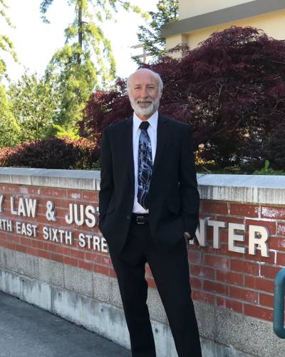 Attorney at computers with a client