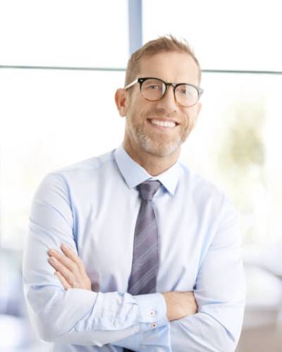 Attorney holding a mug and sitting at computer