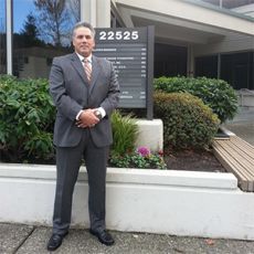 Hal Prukop in front of his office