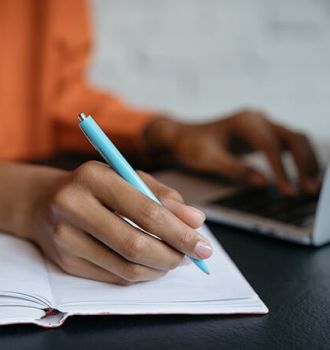 Woman typing at her computer