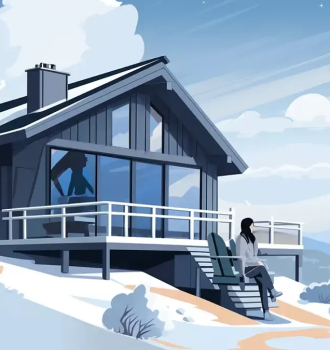 A woman sitting outside a snowy cabin.