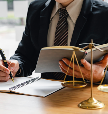 male judge with writing documents on the table