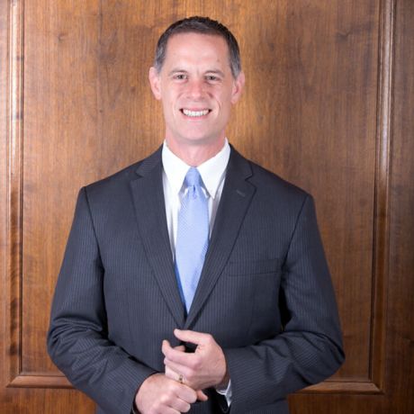 Schrameck smiling in his suit