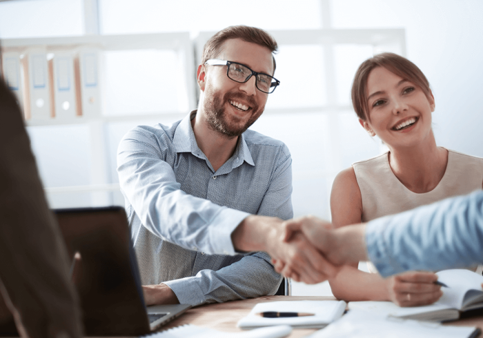 business man shaking hands with his colleague