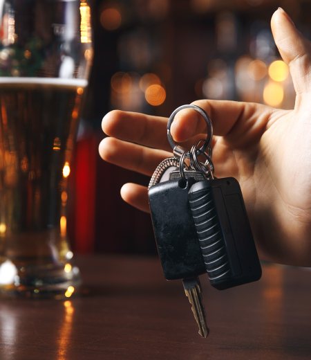 Cropped image of drunk man talking car keys