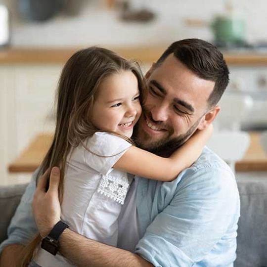 Father and daughter hugging