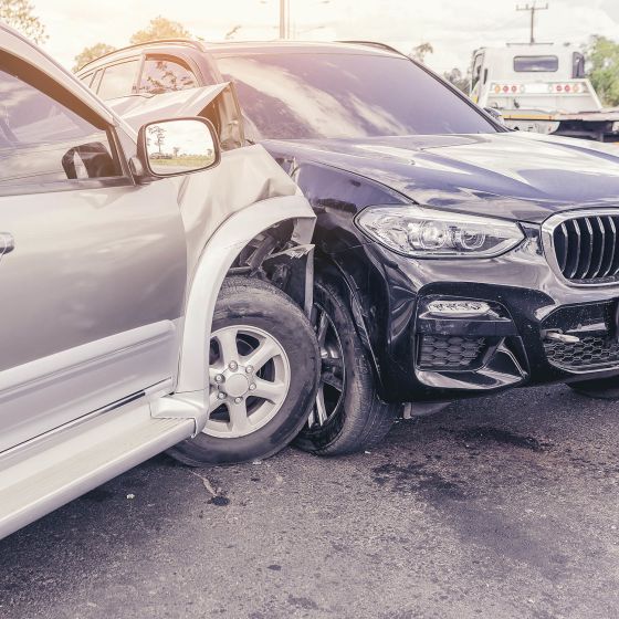 Two large cars involved in a car accident