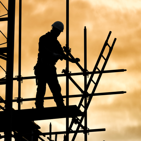 A construction worker on scaffolding.
