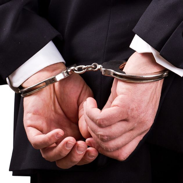 Businessman in handcuffs