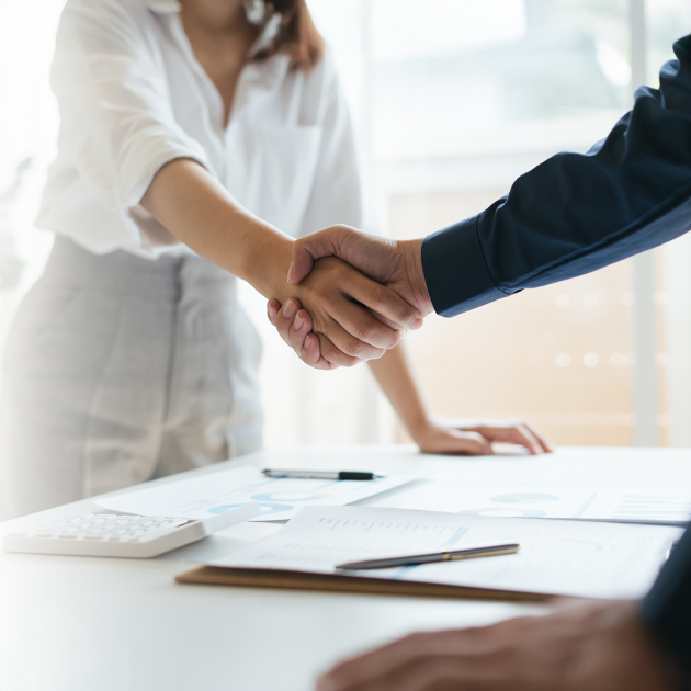 A man and woman shaking hands