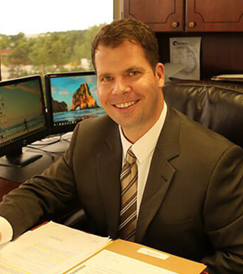 Attorney Braden A. Blumenstiel Sitting in His Office