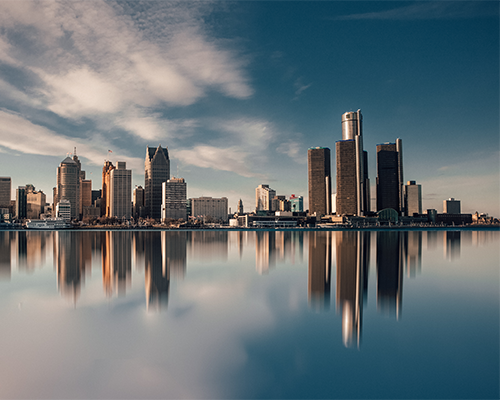 Detroit skyline pictured in front of large body of water