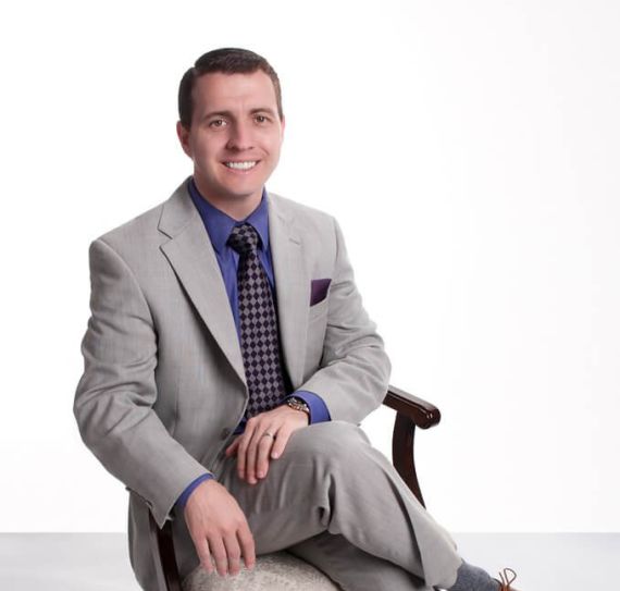 Attorney Zachary McCready sitting in a chair