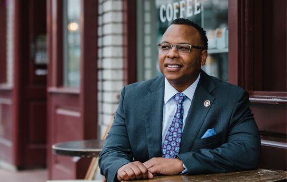 Attorney Kendrick Bradley sitting outside a coffee shop