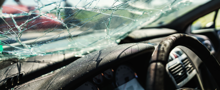 A wrecked windshield on a vehicle