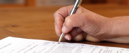 A man checking off items on a form