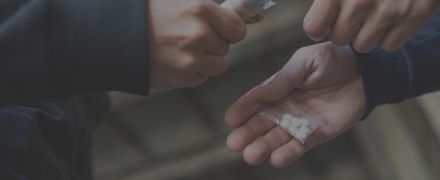addict buying dose from drug dealer