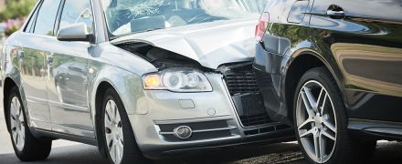 A car wreck between two vehicles.