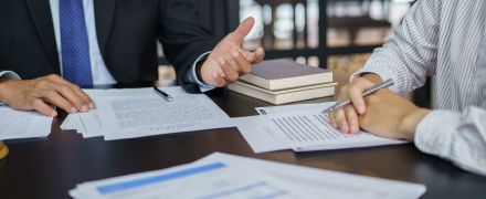 Lawyer Legal counsel presents to the client a signed contract with gavel and legal law. justice and lawyer