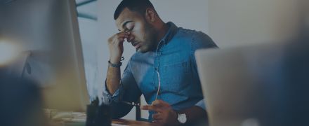 Headache, tired and businessman working in the office with eye strain from the computer or technology.