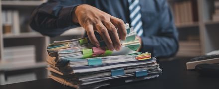 A man sorting through records.