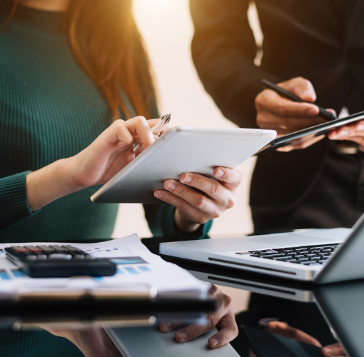 Teamwork with business people analysis cost graph